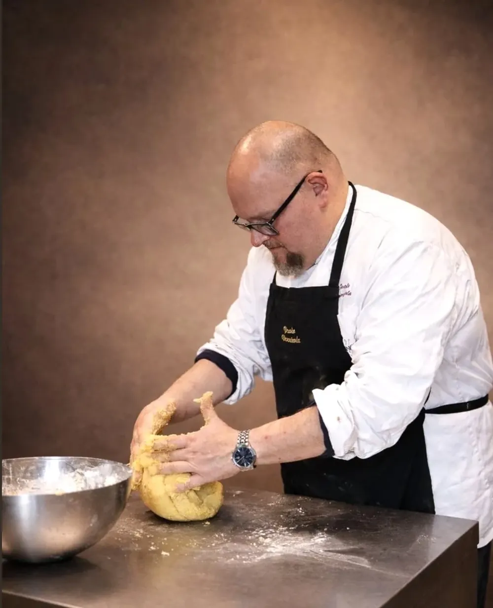 Chef Paolo Vannicola kneading dough by hand